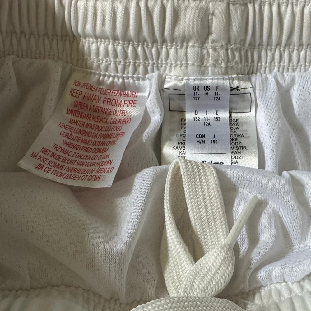 White Adidas Soccer Shorts with Red Manchester United Logo, size Medium 11-12Y